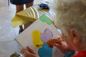 a person painting on a table<br />
