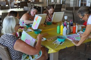 a group of people painting