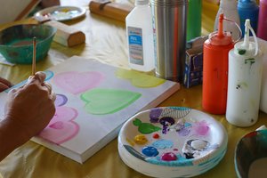 a person painting on a table<br />
