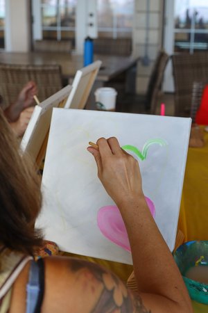 a person painting on a table<br />
