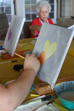 a person painting on a table<br />
