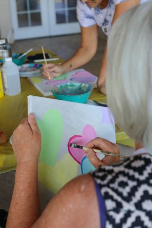 a person painting on a table<br />
