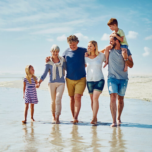 family walking at the beach