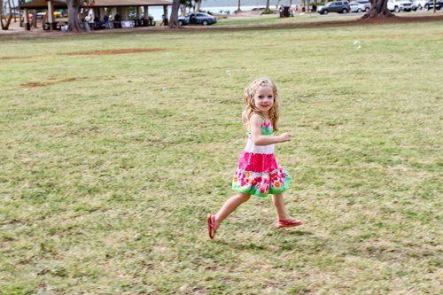 a child walking on the crass