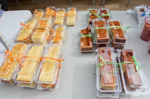 a table with plastic containers of cakes<br />
