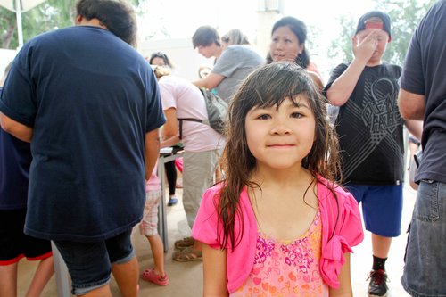 a child posing for a phot o 