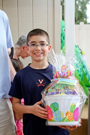 a child holding a basket posing for a photo 