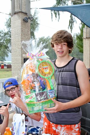 a boy holding a basket 