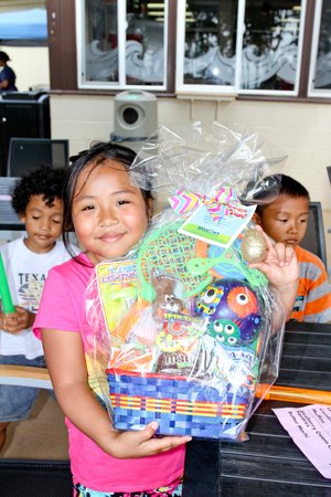 a child holding a basket 