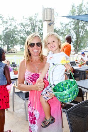 a person holding a child and a basket<br />
