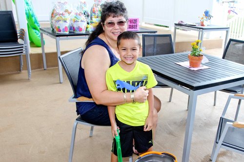 a person and a child sitting at a table<br />
