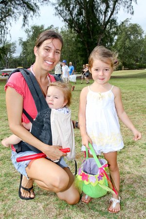 two kids and a person posing for a photo 