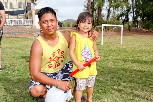 a person and a child posing for a picture<br />
