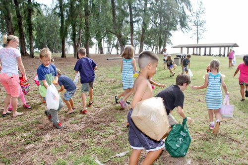 a group of kids playing in the grass<br />
