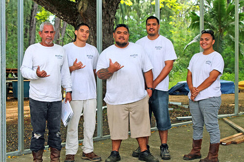 a group of men in white shirts