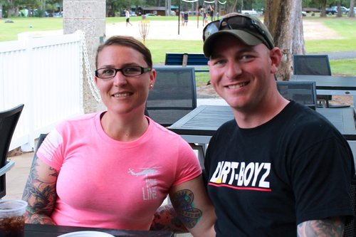 a man and a woman sitting at a table 