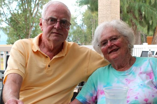 a man and a woman sitting at a table 