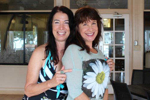 two ladies posing for a photo 