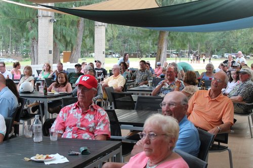 a group of people sitting at tables<br />
