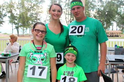 a group of people wearing green outfits<br />
