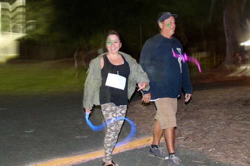 a person and person walking on a road<br />
