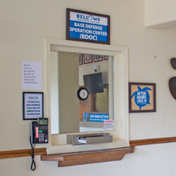 a window with a telephone and a sign on the wall<br />
