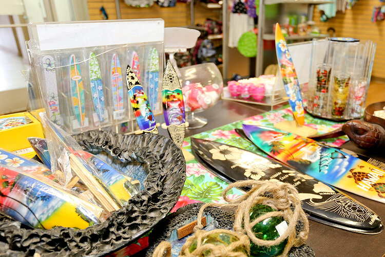 a table with surfboards and other objects