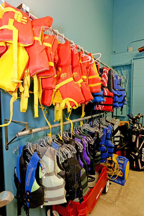 a group of life jackets on a wall