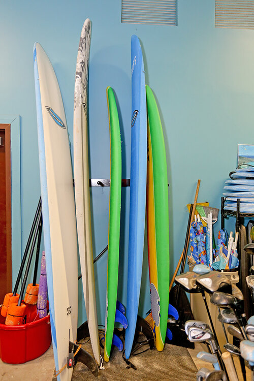 a group of surfboards in a room