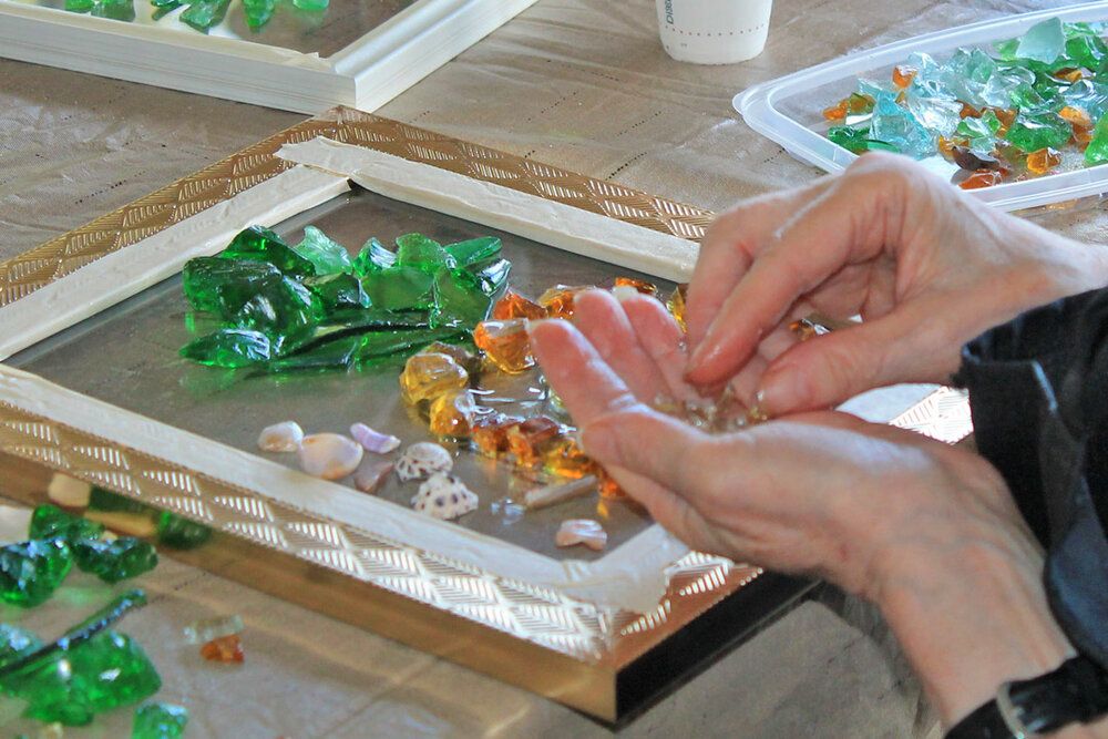 a person holding a piece of glass