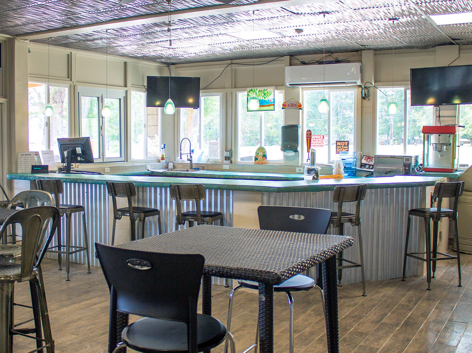 a bar with chairs and tables