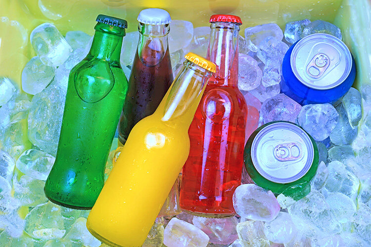 a group of soda bottles in ice