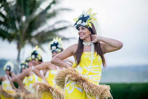 a group of women wearing clothing and dancing