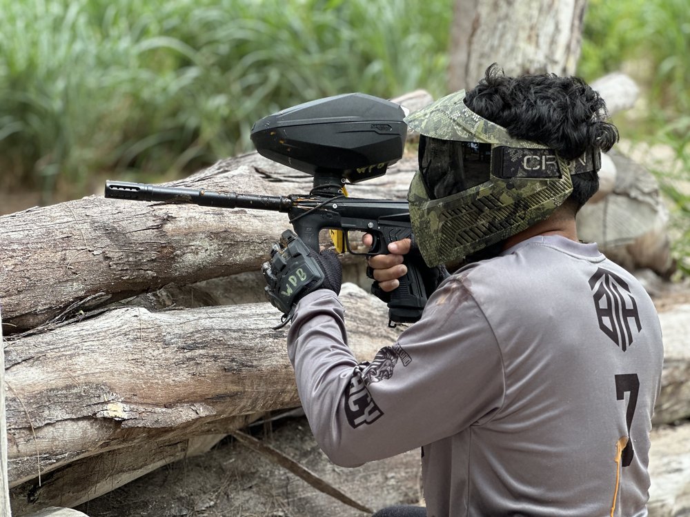 a person wearing a mask and holding a gun