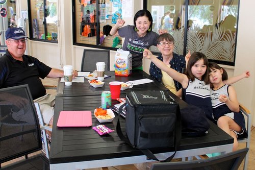 a group of people sitting at a table<br />
