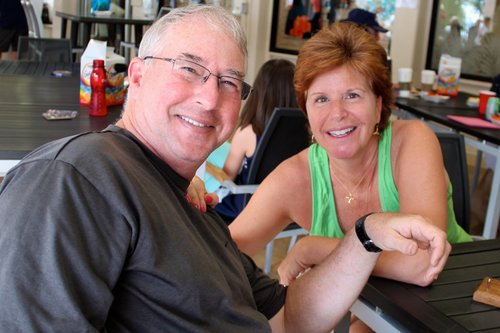 a person and person sitting at a table<br />
